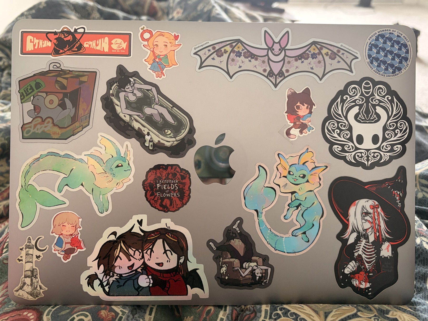 My laptop covered in collected stickers